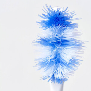 frayed toothbrush from brushing too hard which can lead to gum recession